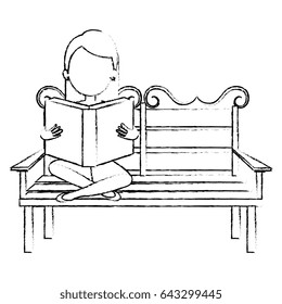 woman reading book in park chair
