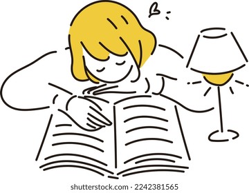 A woman reading a book while lying on her stomach