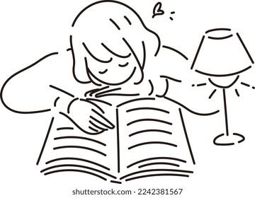 A woman reading a book while lying on her stomach