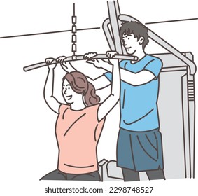 Woman receiving personal training from male trainer at gym