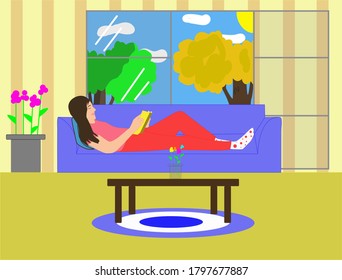 Woman reclining on the couch in her living room, reading a book in her free time, with sunlight streaming through her window
