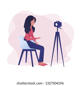 Woman recording vlog video blog.  Vlogger is recording video for online blog, she Is looking at camera. Trendy gradient vector illustration for web landing page, banner, presentation, social media.
