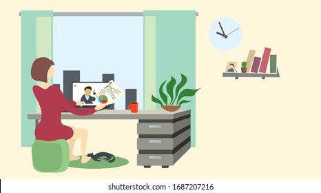 woman in red dress at table table is negotiating a video call via laptop from home. time to work comfortably from home