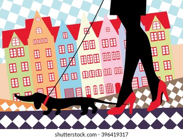 Woman in red shoes walking with a dachshund dog in an old European city.