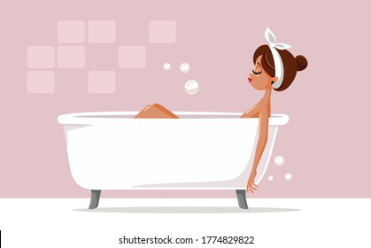 Woman Relaxing in a Bathtub Taking a Long Bath. Pretty girl enjoying some quality time taking a bath
