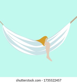 Woman relaxing in a hammock