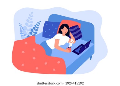 Woman relaxing in her bed, drinking coffee, hot tea, cocoa, using laptop, watching movie in cozy bedroom. For Sunday, weekend, leisure at home concept