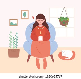 A woman relaxing in the house. A woman is sitting on the sofa and drinking coffee.