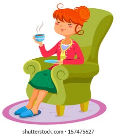 woman relaxing on the sofa with a cup of hot drink