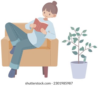 Woman relaxing on sofa and enjoying reading
