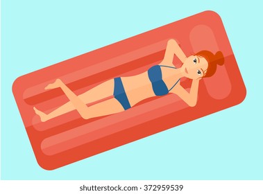 Woman relaxing in swimming pool.