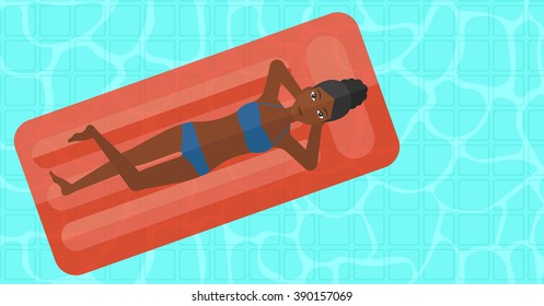 Woman relaxing in swimming pool.