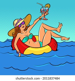 a woman is resting on the sea in an inflatable circle. Tourism and vacation holidays