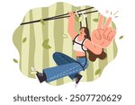 Woman rides zipline in park and shows V gesture, enjoying extreme outdoor recreation. Zipline with smiling girl getting adrenaline rush thanks to active rest and lack of fear of heights