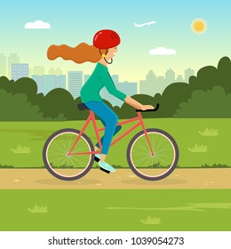 Woman riding a bicycle in a park