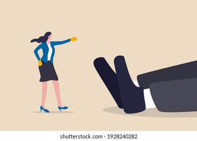 Woman rights, gender inequality fight back, business winning victory concept, brave businesswoman wearing boxing globes just punch knock out giant businessman on the floor.