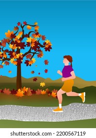 Woman running in the park or forest on a sunny autumn day