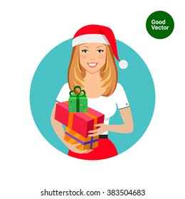 Woman in Santa hat holding gift boxes