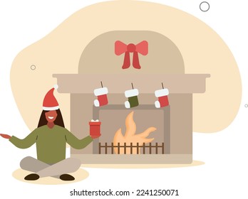 A woman in a Santa hat sits near a fireplace with Christmas accessories. concept of winter holidays and New Year.