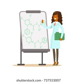 Woman scientist stands next to whiteboard with formula