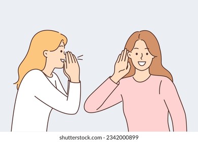 Woman screams to tell interesting news to female friend, puts hand to ear during conversation. Dialogue of beautiful girls exchanging gossip and secrets or telling life stories while conversation