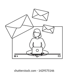 woman seated using laptop computer with envelopes