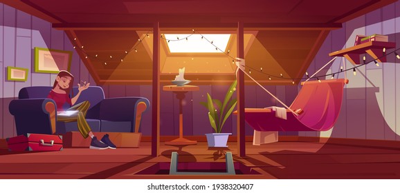 Woman seats with tablet on couch on attic