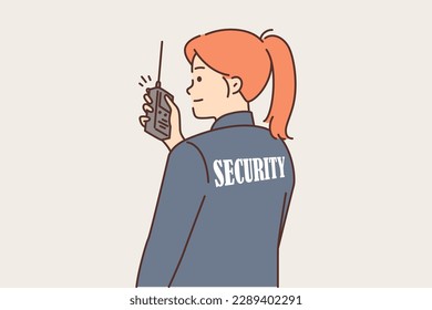 Woman security guard uses walkie-talkie to contact colleagues or report intruder. Girl in uniform with inscription security on back monitors observance of order at stadium or in supermarket