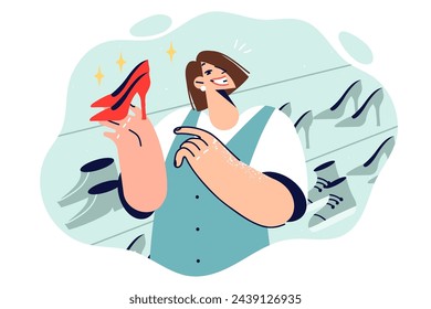 Woman selling shoe store demonstrates ladies high-heeled shoes, offering to purchase high-quality wardrobe item at low price. Girl consultant at shopping boutique recommends trying on shoes