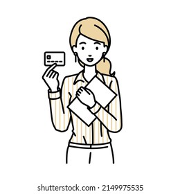 a woman in shirt work style holding a credit card and a document file laptop