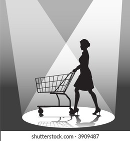 A woman shopper pushes a shopping cart in a spotlight.