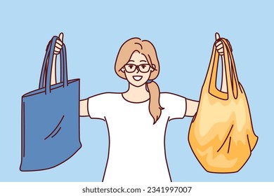 Woman shopper with rag bags for purchases smiles calling for abandonment of plastic packages to avoid pollution. Young happy girl shopper with reusable shopping bags for going to grocery store