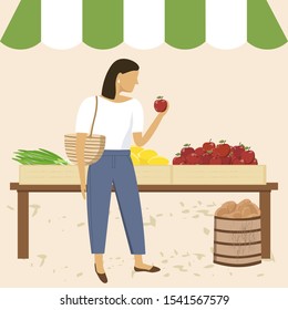 Woman shopping at farmer market. Outdoor grocery shopping, organic nutrition, fresh fruits and vegetables.