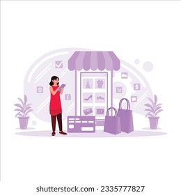 A woman is shopping online through a mobile phone with a credit card payment. Online shopping concept. Trend Modern vector flat illustration