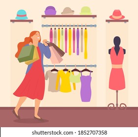Woman is shopping in the store. Young beautiful happy fashion shopper girl picks up packages. Female character with packages in her hands in the boutique. Hanger with a wide selection of clothes