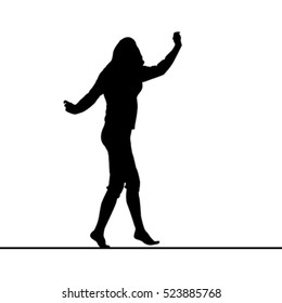 Woman silhouette balancing on slack line