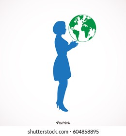 Woman silhouette holding the Earth in hands