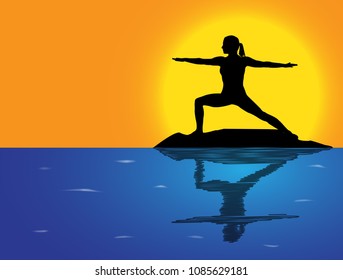 A woman silhouette performing warrior pose on a rock in the sea