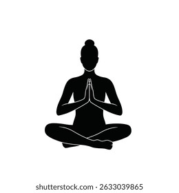 Woman silhouetted in peaceful yoga meditation pose