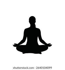Woman silhouetted in peaceful yoga meditation pose.