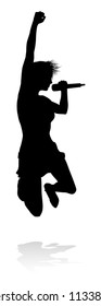 A woman singer pop, country music, rock star or even hiphop rapper artist vocalist singing in silhouette