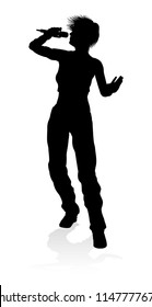 A woman singer pop, country music, rock star or even hiphop rapper artist vocalist singing in silhouette