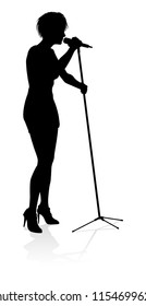 A woman singer pop, country music, rock star or even hiphop rapper artist vocalist singing in silhouette