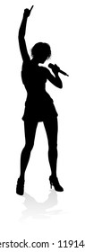 A woman singer pop, country music, rock star or even hiphop rapper artist vocalist singing in silhouette