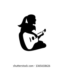 Woman Singing and Playing Guitar