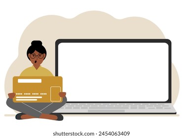 A woman sits cross-legged and holds a large plastic card. Next to the woman is a large laptop with space for text. Vector flat illustration