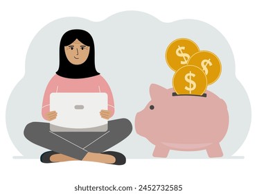 A woman sits cross-legged with a laptop next to a pig piggy bank. Earning money, saving, saving money.