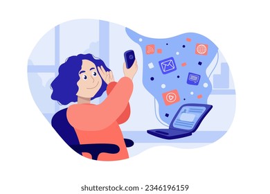 A woman sits at a desk with a laptop and a cell phone in her hand, from the phone idel bubble with pop-up icons 