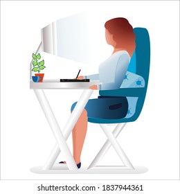 A woman sits at her desk and draws on a graphics tablet. The concept of the profession of a graphic designer and illustrator of paintings. Freelance at home. Office work.