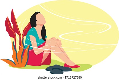 A Woman Sits On The Grass During The Daytime Enjoying The Cool Breeze